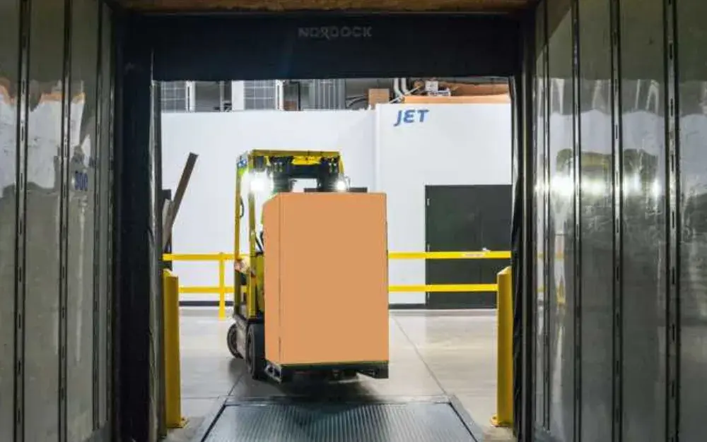 forklift uploading a pallet to a truck